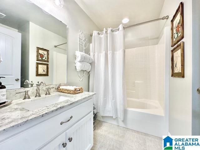 bathroom featuring shower / tub combo with curtain, vanity, and tile patterned flooring