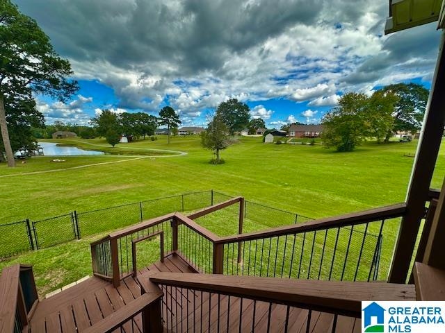 view of yard featuring a deck with water view