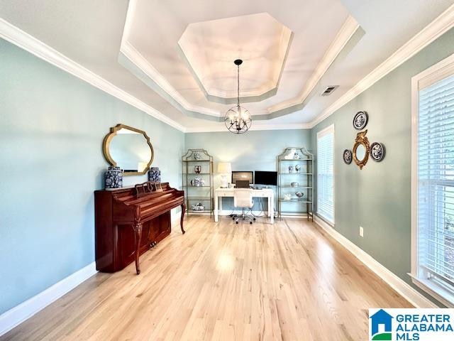 home office featuring wood-type flooring, a chandelier, plenty of natural light, and crown molding