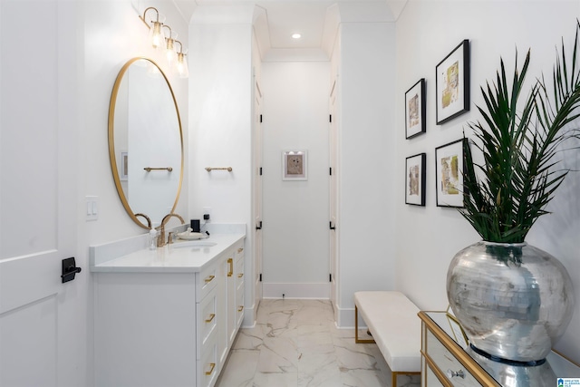 bathroom with vanity and crown molding