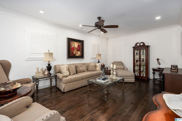 living room with ornamental molding, ceiling fan, and dark hardwood / wood-style floors