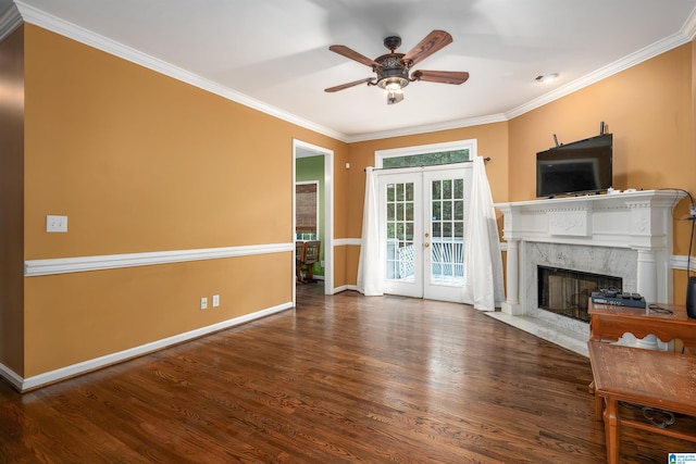 unfurnished living room featuring a high end fireplace, crown molding, ceiling fan, french doors, and dark hardwood / wood-style floors