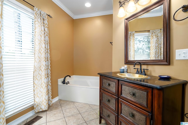 bathroom featuring a bathtub, ornamental molding, tile patterned flooring, and vanity