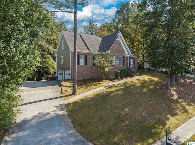 view of front of house featuring a front yard and a garage