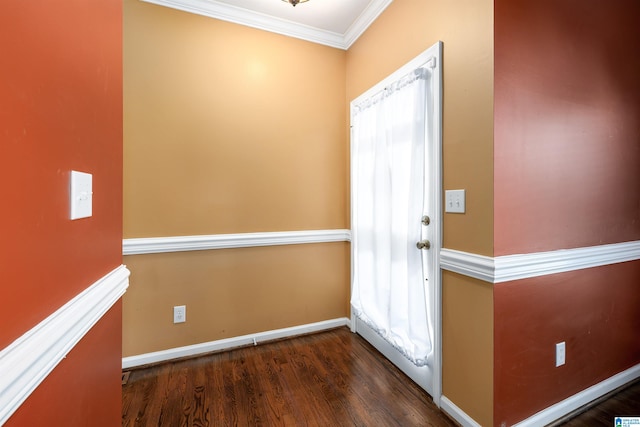 foyer with crown molding and dark wood-type flooring