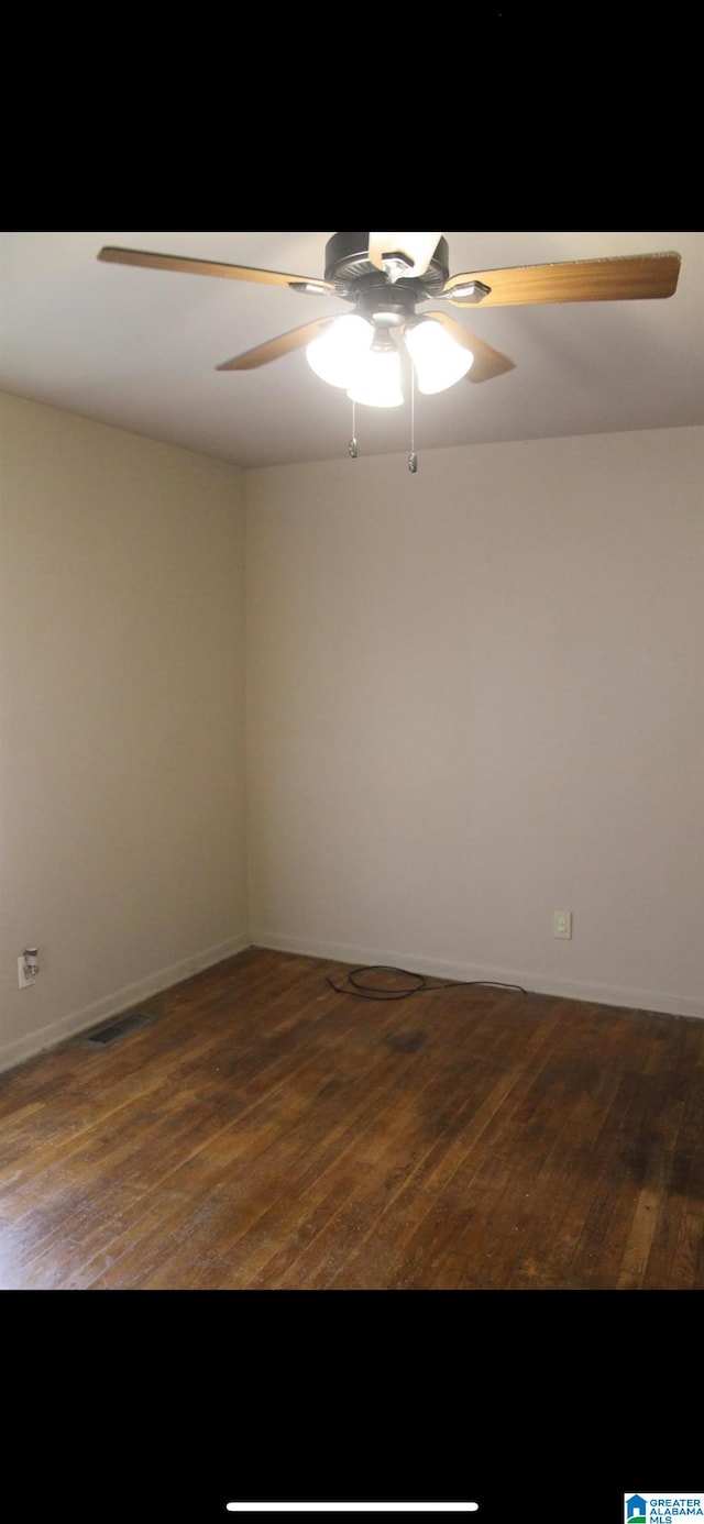 unfurnished room featuring dark hardwood / wood-style floors and ceiling fan