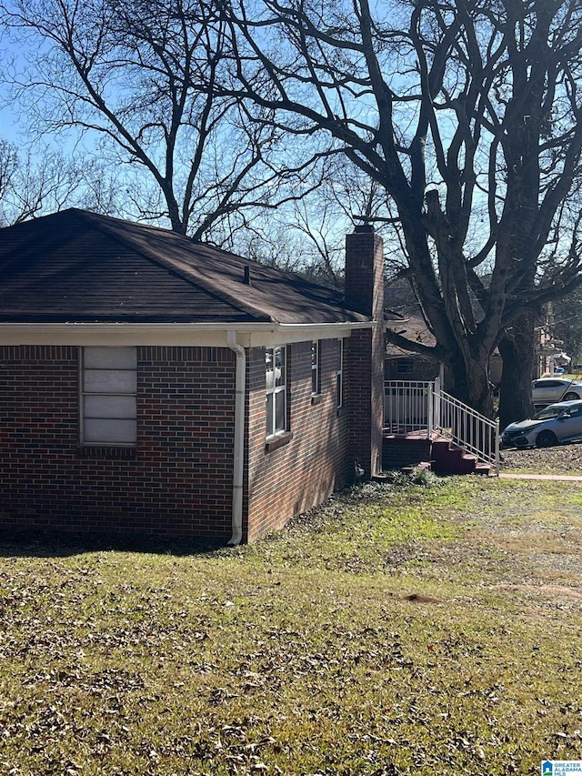 view of home's exterior featuring a yard