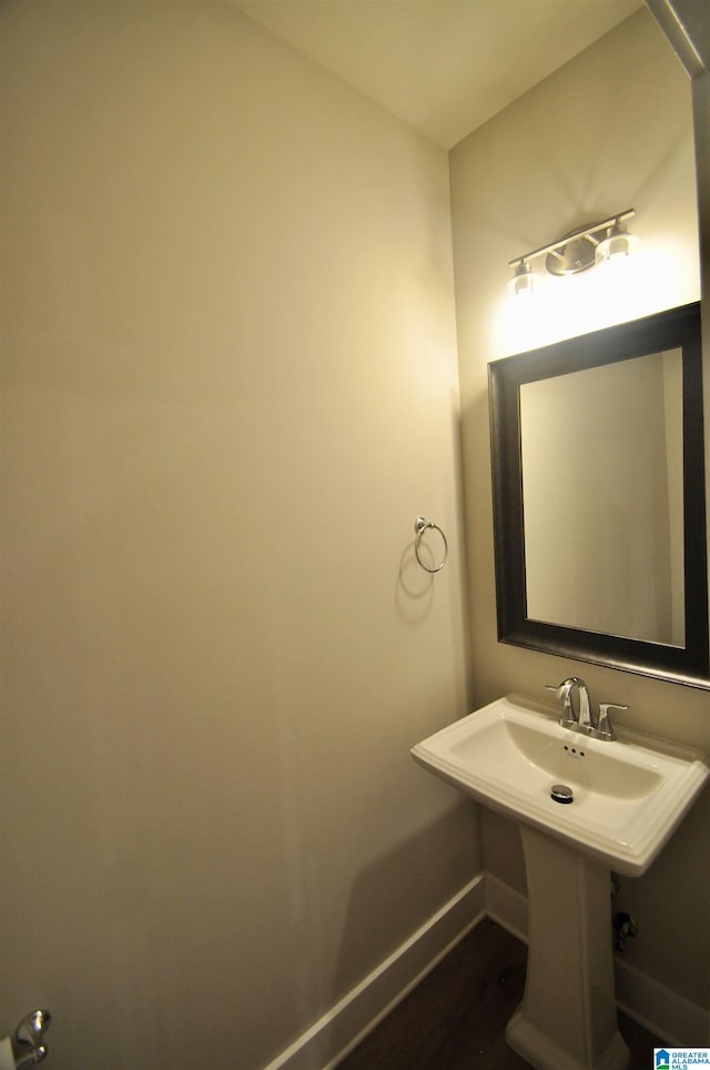 bathroom with wood-type flooring