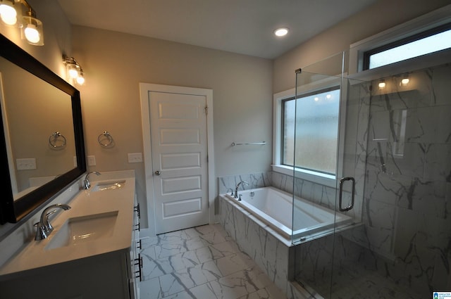 bathroom featuring vanity, shower with separate bathtub, and a healthy amount of sunlight