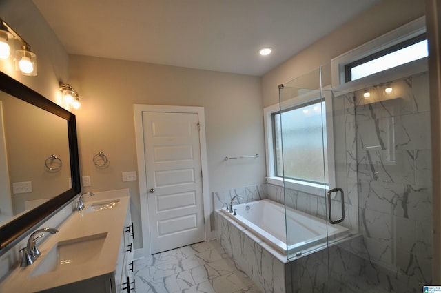 bathroom with vanity and separate shower and tub