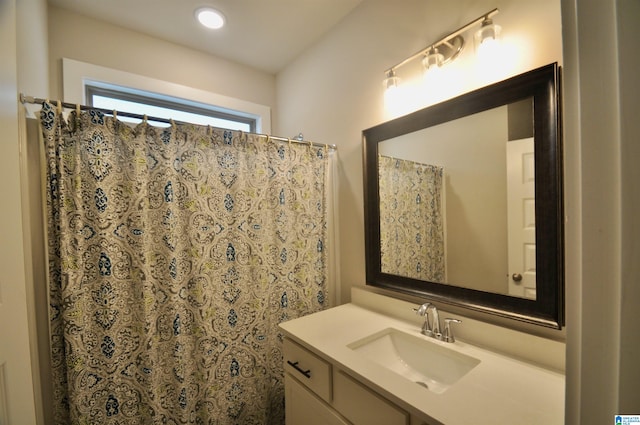 bathroom with vanity and a shower with shower curtain