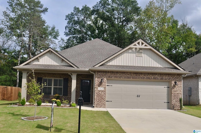 craftsman-style home with a front yard and a garage