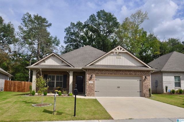 craftsman inspired home with a front yard and a garage