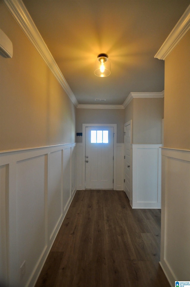 doorway featuring an AC wall unit, dark wood-type flooring, and crown molding