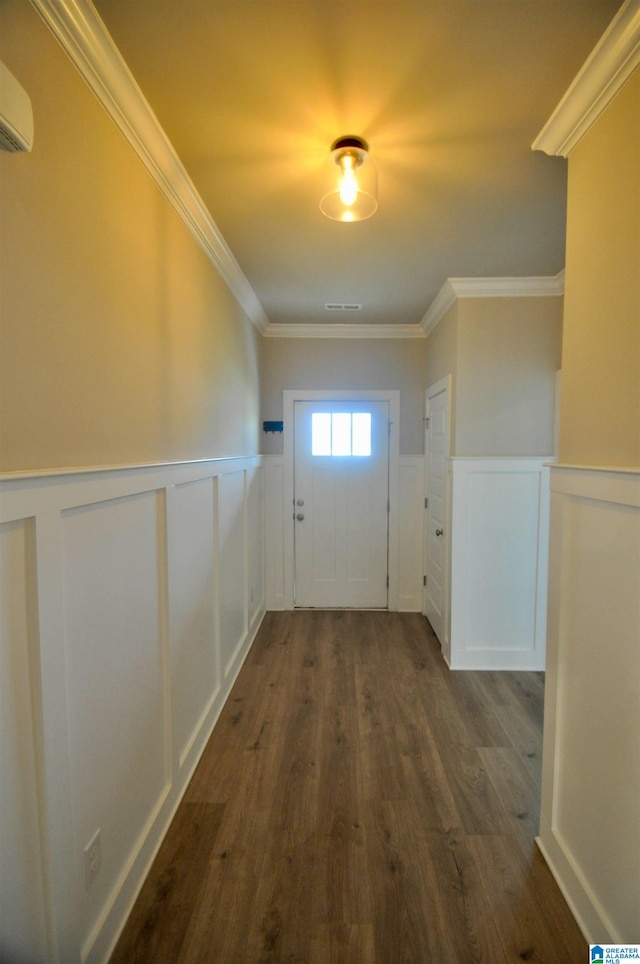 entryway with ornamental molding, dark hardwood / wood-style flooring, and a wall mounted AC