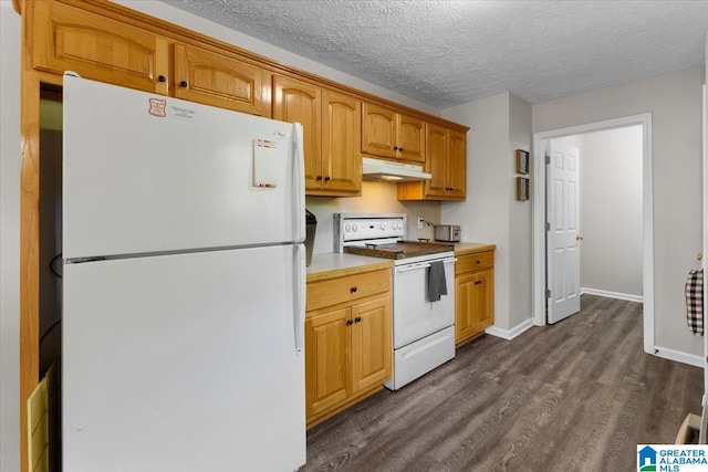 kitchen featuring a textured ceiling, dark hardwood / wood-style floors, and white appliances