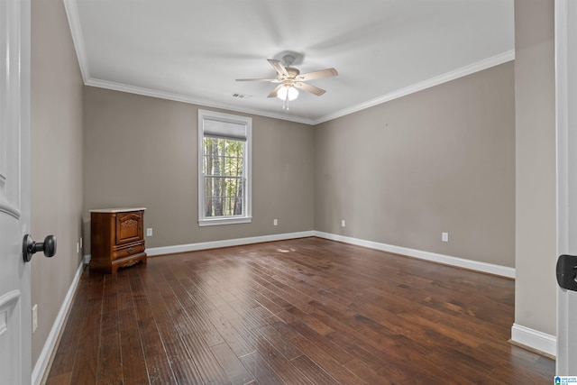 spare room featuring ornamental molding, dark wood-type flooring, and ceiling fan