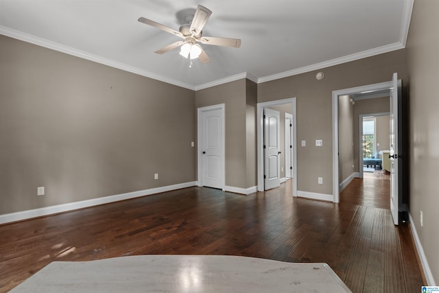 unfurnished bedroom featuring ceiling fan, dark wood-type flooring, and crown molding