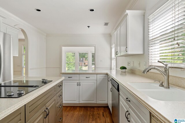 kitchen with white cabinets, dishwasher, black electric cooktop, and sink