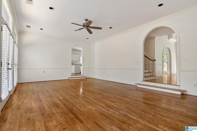 unfurnished room with ceiling fan, hardwood / wood-style flooring, and crown molding