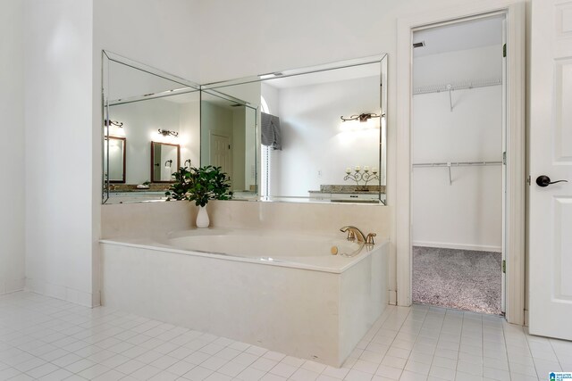 bathroom featuring tile patterned flooring and a tub