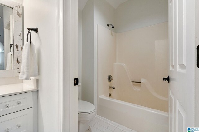 full bathroom with shower / bathing tub combination, tile patterned flooring, vanity, and toilet