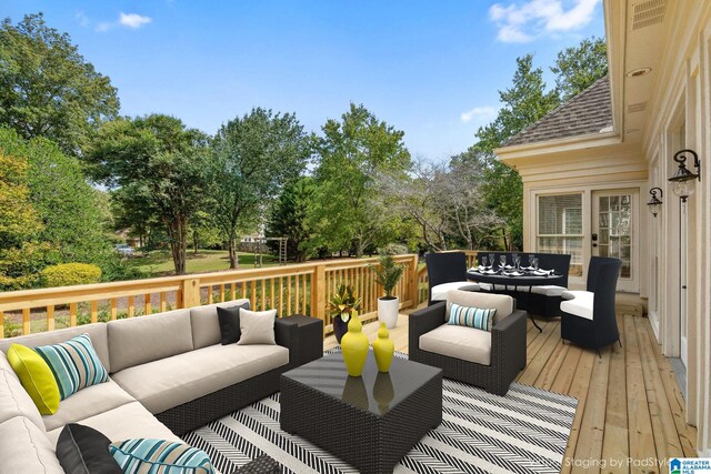 wooden deck featuring an outdoor hangout area