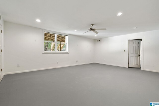 unfurnished room with concrete flooring and ceiling fan