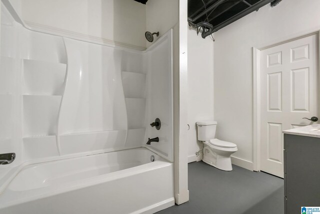 full bathroom with concrete flooring, shower / bathtub combination, vanity, and toilet