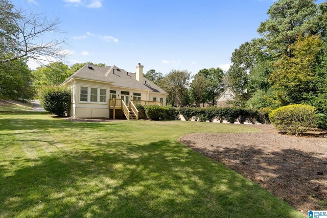 view of yard with a wooden deck