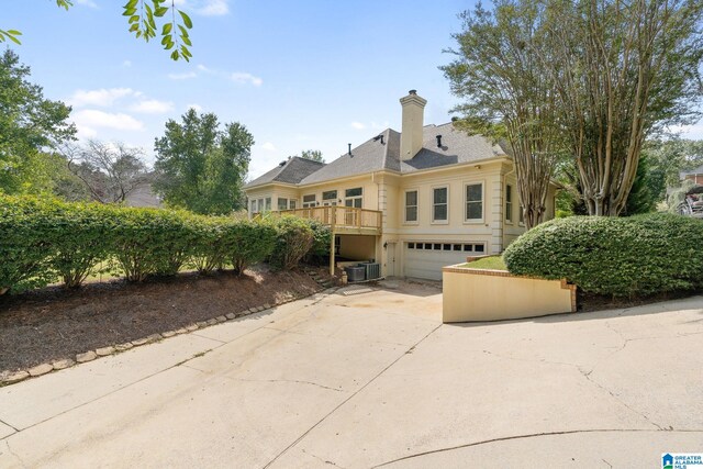 exterior space featuring a garage and central air condition unit