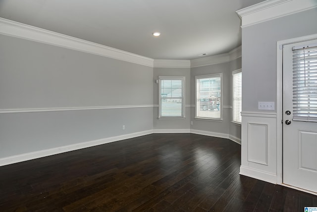 unfurnished living room featuring dark hardwood / wood-style floors and crown molding