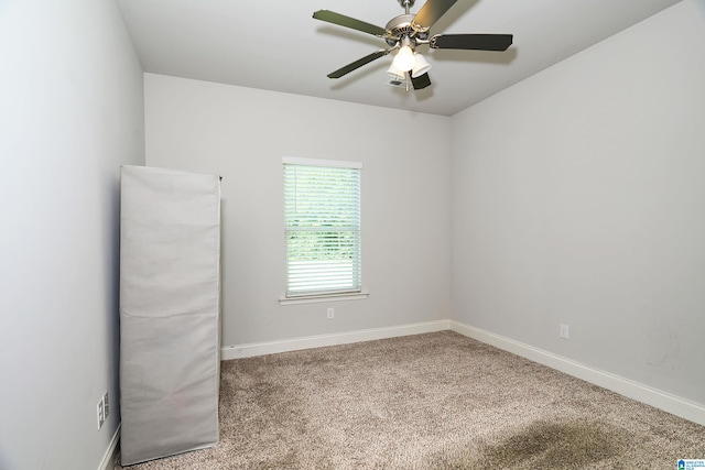 unfurnished room with ceiling fan and carpet flooring