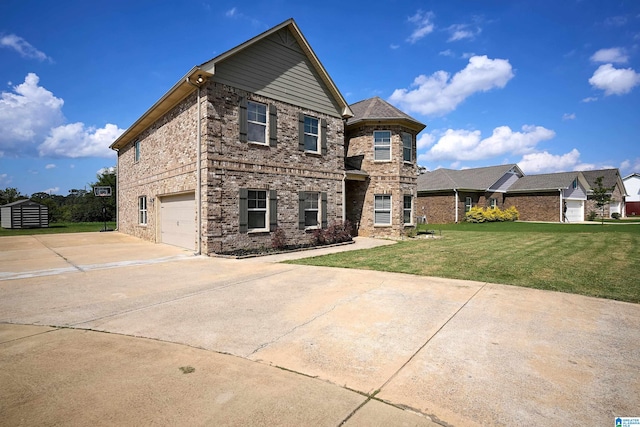 view of front of home featuring a front yard and a garage