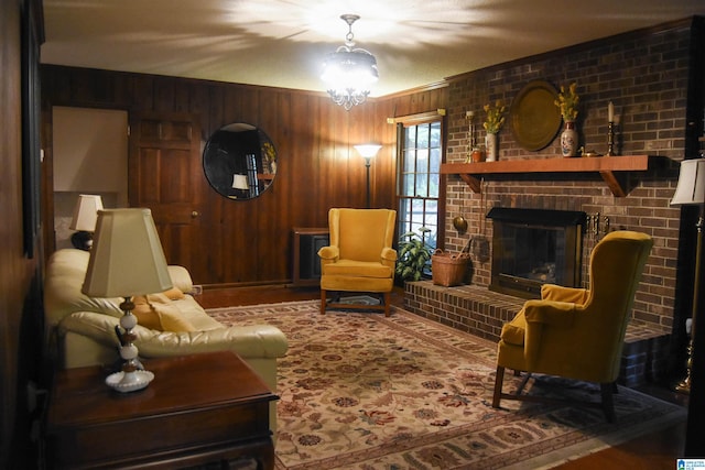 living room with a fireplace, wooden walls, hardwood / wood-style floors, and brick wall