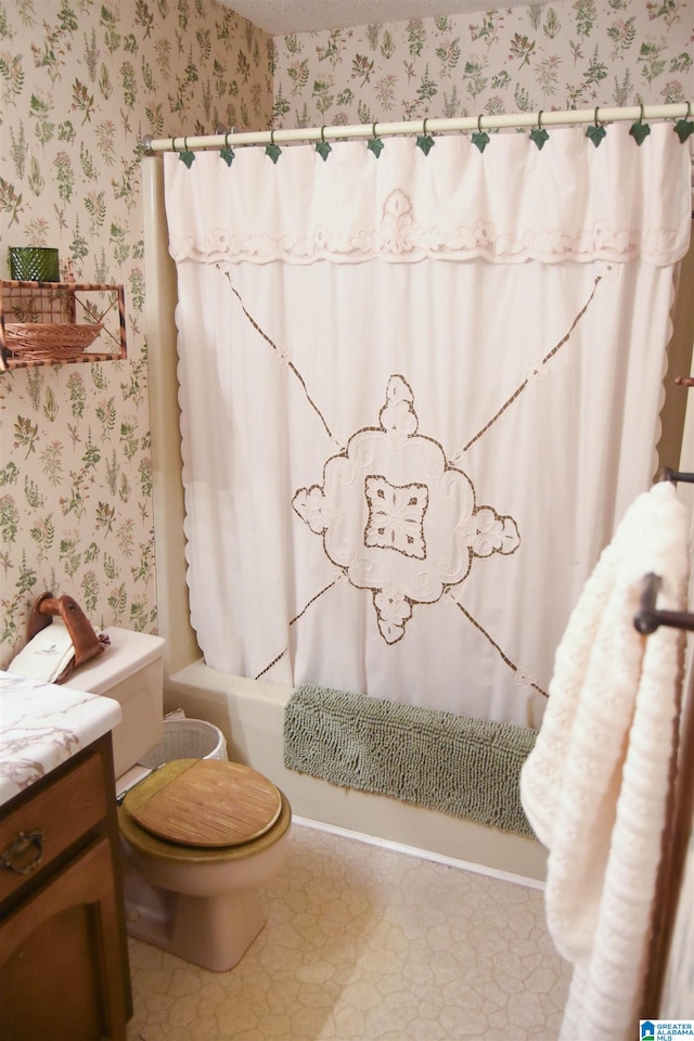 full bathroom featuring vanity, toilet, and shower / bath combo with shower curtain