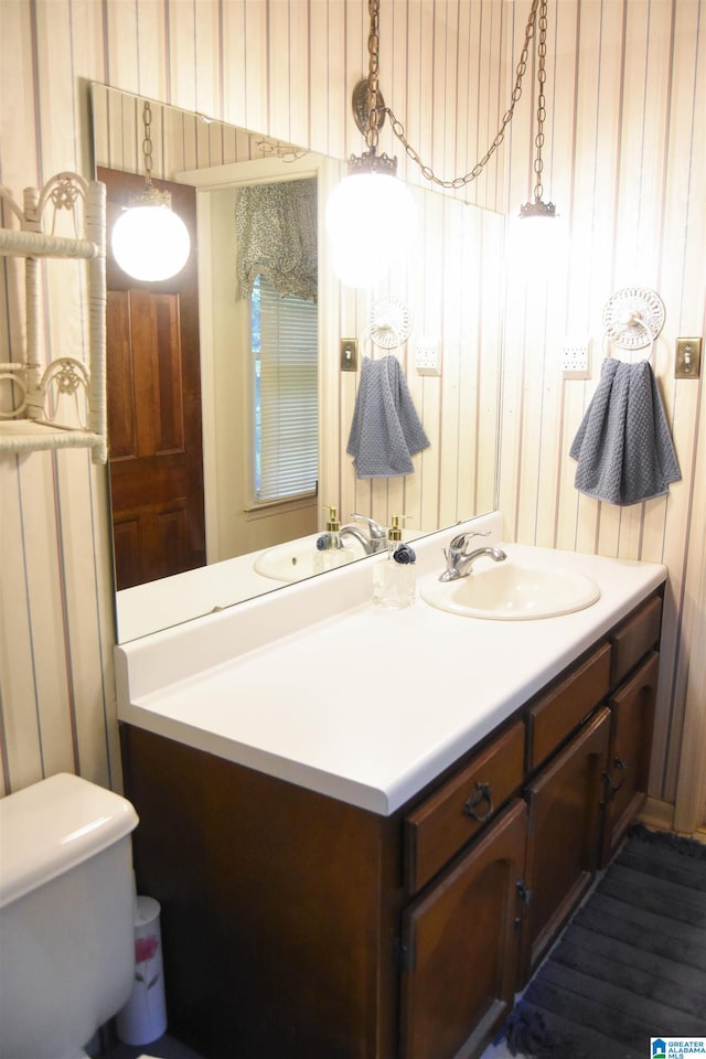 bathroom featuring vanity and toilet