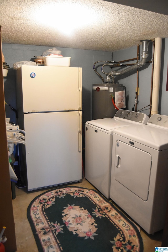 clothes washing area with a textured ceiling, gas water heater, and independent washer and dryer