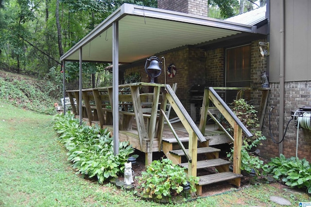 entrance to property featuring a lawn