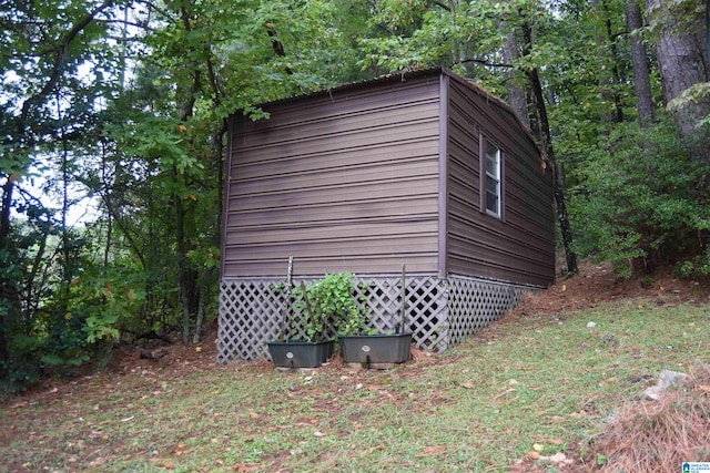 exterior space with a storage shed