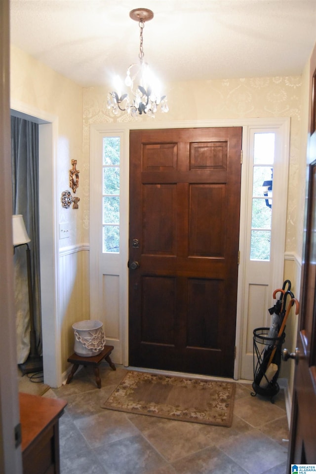 entrance foyer with a notable chandelier