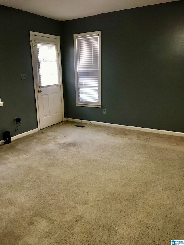 unfurnished room with carpet flooring