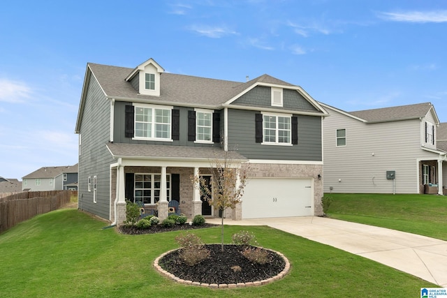 craftsman inspired home featuring a front yard and a garage