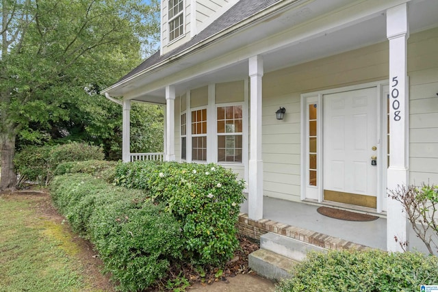 entrance to property featuring a porch