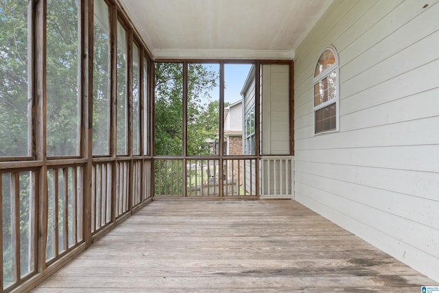 unfurnished sunroom with a wealth of natural light