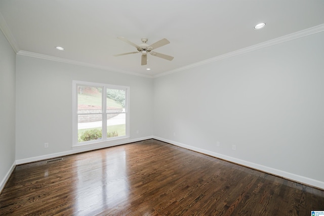 empty room with ornamental molding, dark hardwood / wood-style flooring, and ceiling fan