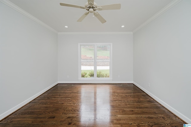 empty room featuring ornamental molding, dark wood-type flooring, and ceiling fan