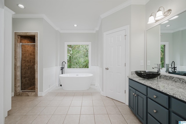 bathroom with crown molding, vanity, and plus walk in shower