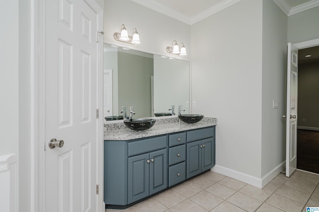 bathroom with crown molding, vanity, and tile patterned floors