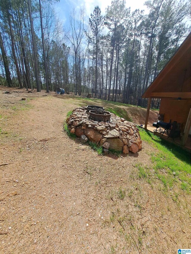 view of yard featuring a fire pit